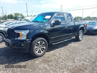 2018 Ford F-150 XL with VIN 1FTEX1EP5JKG01004, listed as a IAAI auction lot 42583232 with 123,258 mi miles and . Bid and sale history available at DreamBid. Image 2.