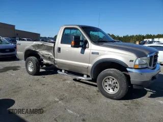 2002 Ford F-250 XL with VIN 1FTNF21L02EA83007, listed as a Copart auction lot 87880345 with 104,889 mi miles and Salvage title. Bid and sale history available at DreamBid. Image 4.