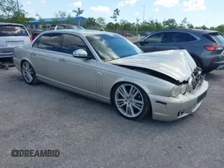 2009 Jaguar XJ with VIN SAJWA94C49TH30042, listed as a IAAI auction lot 41898085 with 145,832 mi miles and . Bid and sale history available at DreamBid. Image 1.