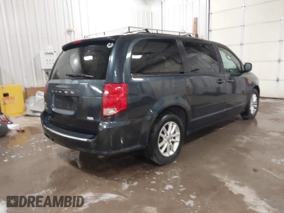 2014 Dodge Grand Caravan SXT with VIN 2C4RDGCGXER154709, listed as a IAAI auction lot 41117603 with 214,872 mi miles and . Bid and sale history available at DreamBid. Image 4.