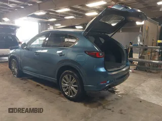 2023 Mazda CX-5 Signature with VIN JM3KFBXY4P0120187, listed as a IAAI auction lot 41706264 with 9,402 mi miles and . Bid and sale history available at carsss.com. Image 3.