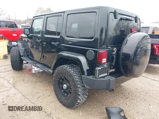 2014 Jeep Wrangler Unlimited Sahara with VIN 1C4HJWEG1EL202974, listed as a IAAI auction lot 41591870 with 17,174 mi miles. Bid and sale history available at carsss.com. Image 3.