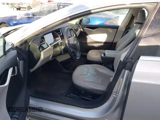 2013 Tesla Model S with VIN 5YJSA1CG3DFP28908, listed as a IAAI auction lot 41804041 with 140,756 mi miles and . Bid and sale history available at DreamBid. Image 5.