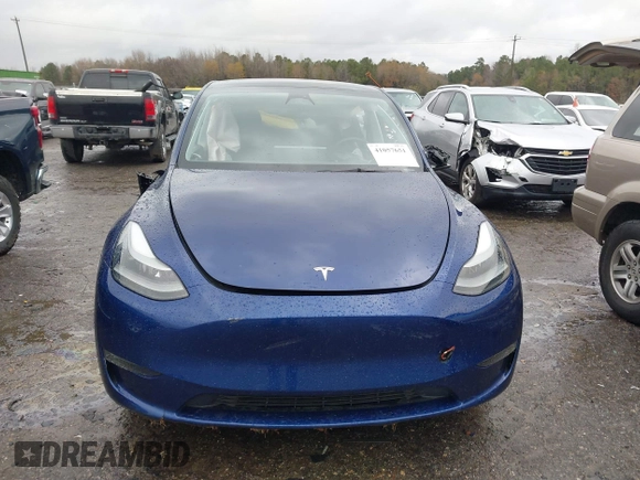 2023 Tesla Model Y Long Range with VIN 7SAYGDEE7PF673988, listed as a IAAI auction lot 41057651 with 29,683 mi miles and . Bid and sale history available at DreamBid. Image 11.