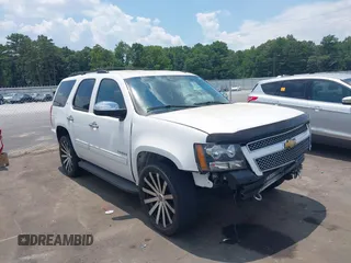 2013 Chevrolet Tahoe LT with VIN 1GNSCBE07DR328268, listed as a IAAI auction lot 42696221 with 149,785 mi miles and . Bid and sale history available at DreamBid. Image 1.