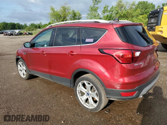 2019 Ford Escape Titanium with VIN 1FMCU0J98KUC00873, listed as a Copart auction lot 61674305 with 53,554 mi miles and Salvage title. Bid and sale history available at DreamBid. Image 2.