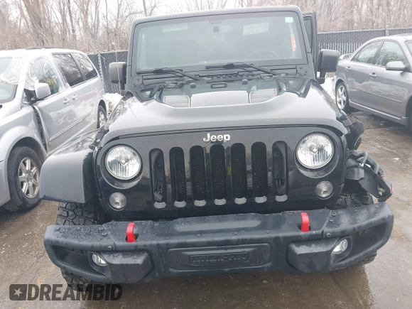 2015 Jeep Wrangler Unlimited Rubicon Hard Rock with VIN 1C4HJWFG9FL569962, listed as a IAAI auction lot 41557801 with 78,597 mi miles and . Bid and sale history available at DreamBid. Image 12.