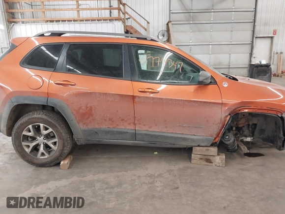 2015 Jeep Cherokee Trailhawk with VIN 1C4PJMBS5FW524462, listed as a IAAI auction lot 41774347 with 107,592 mi miles. Bid and sale history available at carsss.com. Image 14.