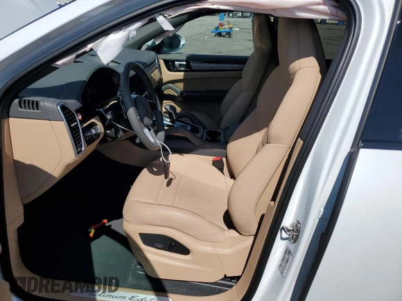 2023 Porsche Cayenne E-Hybrid z VIN WP1BE2AY0PDA28263, wystawiony jako Copart lot #67593303 z przebiegiem 6 944 mil mil oraz . Historia ofert i sprzedaży dostępna na DreamBid. Obrazek 7.