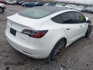 2022 Tesla Model 3 Long Range with VIN 5YJ3E1EB0NF129945, listed as a IAAI auction lot 41965531 with 59,162 mi miles and . Bid and sale history available at DreamBid. Image 4.