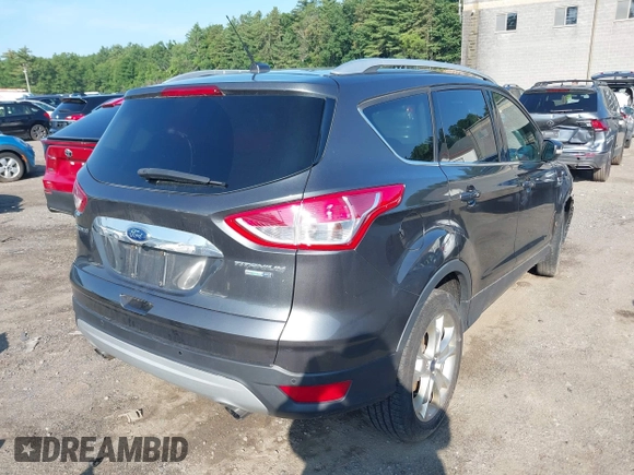 2016 Ford Escape Titanium with VIN 1FMCU9J99GUB27573, listed as a IAAI auction lot 42445457 with 156,784 mi miles and . Bid and sale history available at DreamBid. Image 4.
