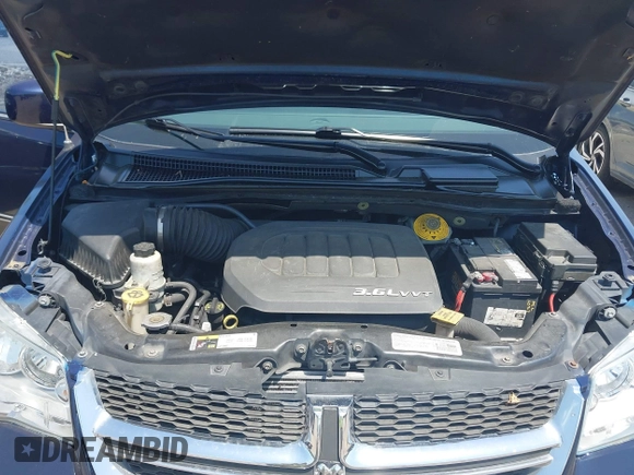 2014 Dodge Grand Caravan SXT with VIN 2C4RDGCG3ER266199, listed as a IAAI auction lot 42119064 with 148,067 mi miles and . Bid and sale history available at DreamBid. Image 10.