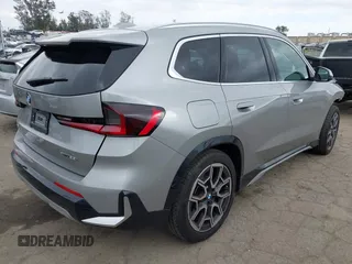 2023 BMW X1 xDrive28i with VIN WBX73EF02P5Y08733, listed as a IAAI auction lot 41901171 with 13,684 mi miles and . Bid and sale history available at DreamBid. Image 4.