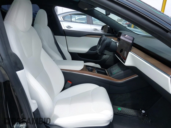 2023 Tesla Model S with VIN 5YJSA1E52PF528795, listed as a IAAI auction lot 42110660 with 21,243 mi miles and . Bid and sale history available at DreamBid. Image 5.