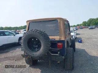 2006 Jeep Wrangler Sport z VIN 1J4FA49S66P708332, wystawiony jako IAAI lot #42402995 z przebiegiem 130 795 mil mil oraz . Historia ofert i sprzedaży dostępna na DreamBid. Obrazek 16.