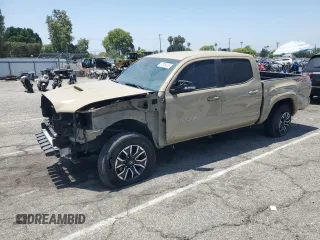 2020 Toyota Tacoma SR5 with VIN 3TMCZ5AN3LM341341, listed as a Copart auction lot 61829415 with 66,576 mi miles and Salvage title. Bid and sale history available at DreamBid. Image 1.