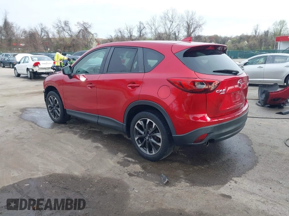 2016 Mazda CX-5 Grand Touring with VIN JM3KE4DY9G0865780, listed as a IAAI auction lot 41913914 with 76,579 mi miles. Bid and sale history available at carsss.com. Image 3.