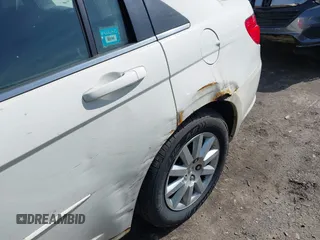 2010 Chrysler Sebring Touring with VIN 1C3CC4FB3AN153906, listed as a IAAI auction lot 41927843 with 131,079 mi miles and . Bid and sale history available at DreamBid. Image 6.