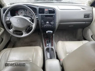 2000 Infiniti G20 Luxury z VIN JNKCP11A1YT304887, wystawiony jako Copart lot #74562724 z przebiegiem 202 140 mil mil oraz Czysty tytuł • Clean title. Historia ofert i sprzedaży dostępna na DreamBid. Obrazek 8.