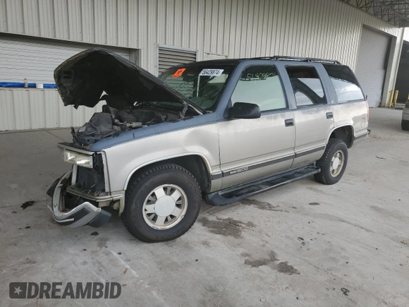 1999 GMC Yukon with VIN 1GKEC13R4XJ735246, listed as a Copart auction lot 56429874 with 258,616 mi miles and Salvage Title. Bid and sale history available at carsss.com. Image 1.