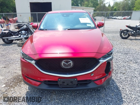 2021 Mazda CX-5 Grand Touring with VIN JM3KFBDM3M0434569, listed as a IAAI auction lot 42422349 with 25,924 mi miles and . Bid and sale history available at DreamBid. Image 12.