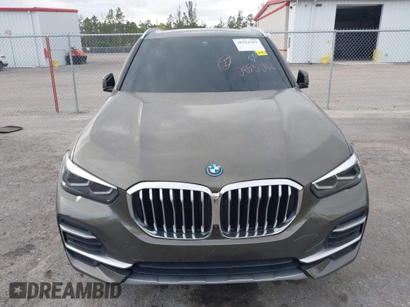 2022 BMW X5 xDrive45e z VIN 5UXTA6C00N9L06383, wystawiony jako IAAI lot #38552162 z przebiegiem 19 592 mil mil oraz . Historia ofert i sprzedaży dostępna na DreamBid. Obrazek 6.