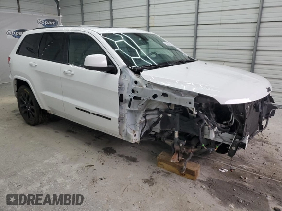 2022 Jeep Grand Cherokee WK Laredo X with VIN 1C4RJEAG1NC128279, listed as a Copart auction lot 70806244 with 104,478 mi miles and Salvage Title. Bid and sale history available at carsss.com. Image 4.