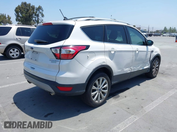 2018 Ford Escape Titanium with VIN 1FMCU0J94JUB26110, listed as a IAAI auction lot 42436285 with 59,586 mi miles and . Bid and sale history available at DreamBid. Image 4.