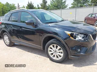 2014 Mazda CX-5 Touring z VIN JM3KE4CY0E0315706, wystawiony jako IAAI lot #42407728 z przebiegiem 233 067 mil mil oraz . Historia ofert i sprzedaży dostępna na DreamBid. Obrazek 1.