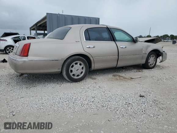 2000 Lincoln Town Car Signature с VIN 1LNHM82W1YY903645, выставлен на аукционе Copart как лот 55663175 с пробегом Не указан миль и Списание • Salvage title. История ставок и продаж доступна на DreamBid. Изображение 3.