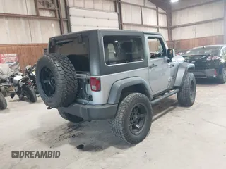 2014 Jeep Wrangler Sport with VIN 1C4AJWAG0EL173362, listed as a IAAI auction lot 42231863 with 99,321 mi miles and . Bid and sale history available at DreamBid. Image 4.