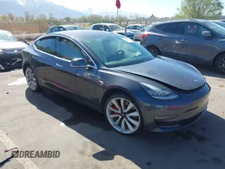 2018 Tesla Model 3 Long Range Battery with VIN 5YJ3E1EBXJF055203, listed as a IAAI auction lot 42019770 with 57,379 mi miles and . Bid and sale history available at DreamBid. Image 1.