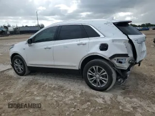 2022 Cadillac XT5 FWD Premium Luxury z VIN 1GYKNCRS0NZ175748, wystawiony jako Copart lot #61651885 z przebiegiem 13 747 mil mil oraz Szkoda całkowita • Salvage title. Historia ofert i sprzedaży dostępna na DreamBid. Obrazek 2.