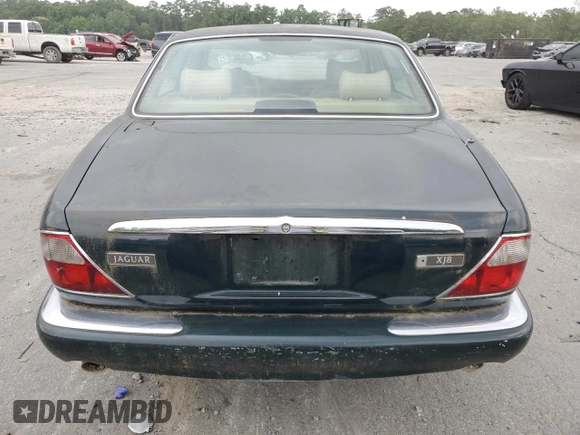 1999 Jaguar XJ with VIN SAJHX1044XC865054, listed as a Copart auction lot 57825325 with 71,145 mi miles and Clean title. Bid and sale history available at DreamBid. Image 6.