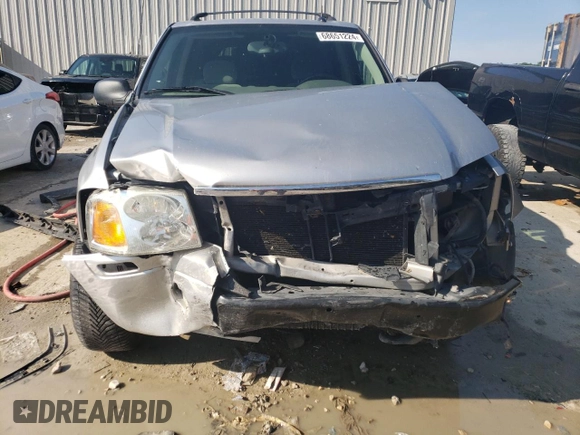 2005 GMC Envoy SLE z VIN 1GKDT13S552122428, wystawiony jako Copart lot #68651224 z przebiegiem 111 931 mil mil oraz Szkody całkowita. Historia ofert i sprzedaży dostępna na DreamBid. Obrazek 5.