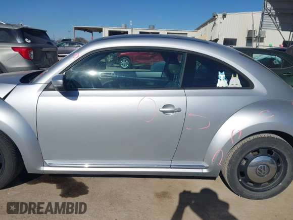 2013 Volkswagen Beetle 2.5L w/Sun/Sound/Nav with VIN 3VWJX7AT3DM663774, listed as a IAAI auction lot 41738146 with 98,064 mi miles and . Bid and sale history available at DreamBid. Image 14.