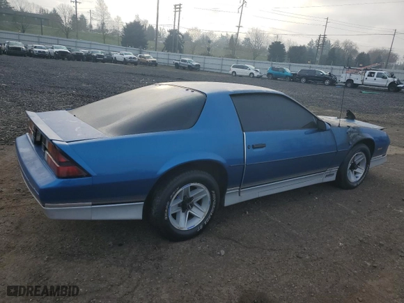 1985 Chevrolet Camaro Z28 Sport with VIN 1G1FP87H2FN114697, listed as a Copart auction lot 89329895 with 0 mi miles and Salvage Title. Bid and sale history available at carsss.com. Image 3.