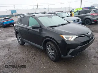 2018 Toyota RAV4 LE with VIN 2T3BFREV2JW788700, listed as a IAAI auction lot 41986212 with 87,704 mi miles. Bid and sale history available at carsss.com. Image 1.