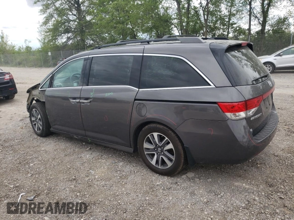 2014 Honda Odyssey Touring with VIN 5FNRL5H90EB014360, listed as a Copart auction lot 56699845 with 180,913 mi miles and Salvage title. Bid and sale history available at DreamBid. Image 2.