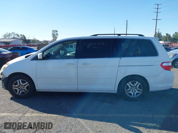2006 Honda Odyssey EX z VIN 5FNRL38486B410286, wystawiony jako IAAI lot #41641433 z przebiegiem 145 312 mil mil oraz . Historia ofert i sprzedaży dostępna na DreamBid. Obrazek 14.