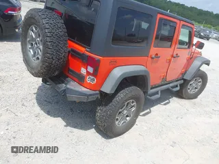 2015 Jeep Wrangler Unlimited Rubicon z VIN 1C4BJWFG4FL598033, wystawiony jako IAAI lot #42435523 z przebiegiem 134 202 mil mil oraz . Historia ofert i sprzedaży dostępna na DreamBid. Obrazek 4.