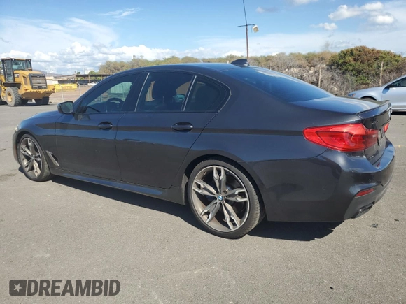 2019 BMW 5 Series M550i xDrive with VIN WBAJB9C57KB289036, listed as a Copart auction lot 86292134 with 28,103 mi miles and Salvage title. Bid and sale history available at DreamBid. Image 2.