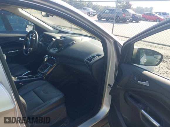 2013 Ford Escape Titanium with VIN 1FMCU0J94DUB58785, listed as a IAAI auction lot 42631897 with 163,037 mi miles and . Bid and sale history available at DreamBid. Image 5.