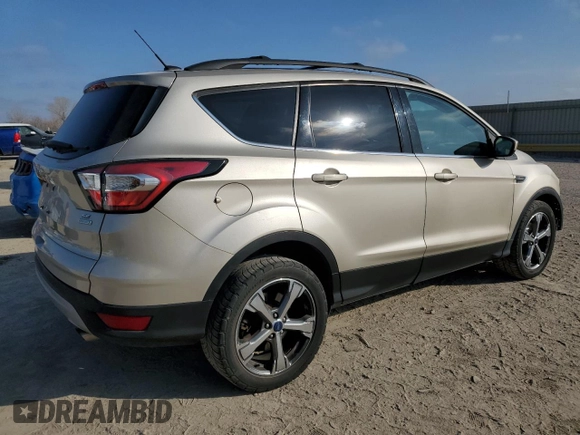 2017 Ford Escape SE with VIN 1FMCU0GD0HUD26729, listed as a Copart auction lot 44824135 with 102,549 mi miles and Salvage Title. Bid and sale history available at carsss.com. Image 3.