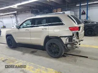 2014 Jeep Grand Cherokee Limited z VIN 1C4RJFBG1EC148908, wystawiony jako Copart lot #54311675 z przebiegiem 90 886 mil mil oraz Szkoda całkowita • Salvage title. Historia ofert i sprzedaży dostępna na DreamBid. Obrazek 2.
