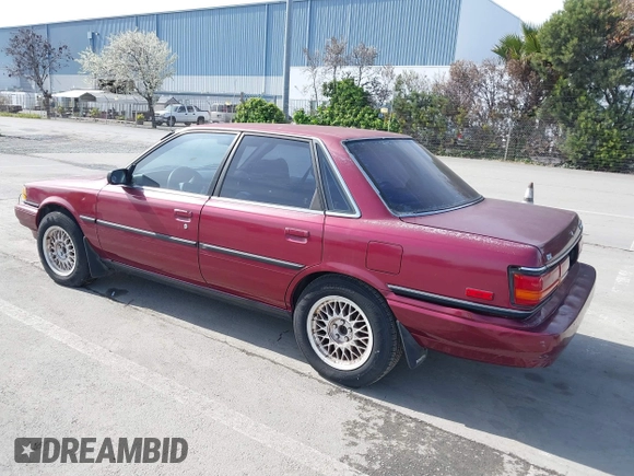 1991 Toyota Camry z VIN JT2SV21E0M3462782, wystawiony jako IAAI lot #41841451 z przebiegiem 214 611 mil mil oraz . Historia ofert i sprzedaży dostępna na DreamBid. Obrazek 3.