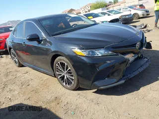 2018 Toyota Camry LE z VIN 4T1B11HK3JU592131, wystawiony jako IAAI lot #41977928 z przebiegiem 106 499 mil mil oraz . Historia ofert i sprzedaży dostępna na DreamBid. Obrazek 1.