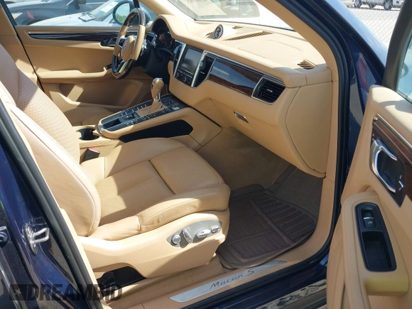 2015 Porsche Macan S with VIN WP1AB2A55FLB67075, listed as a IAAI auction lot 42068637 with 148,068 mi miles. Bid and sale history available at carsss.com. Image 5.