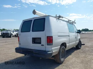 2014 Ford Econoline Cargo Commercial with VIN 1FTNE1EW4EDB20183, listed as a IAAI auction lot 42231075 with 260,818 mi miles and . Bid and sale history available at DreamBid. Image 4.