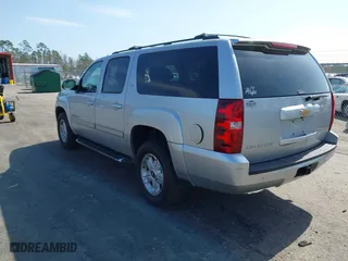 2013 Chevrolet Suburban LT with VIN 1GNSKJE71DR213143, listed as a IAAI auction lot 41585336 with 103,635 mi miles. Bid and sale history available at carsss.com. Image 3.